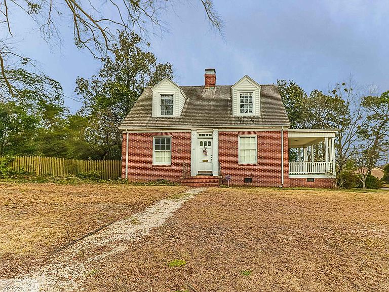 Potential with this brick home. One acre in North Carolina. Circa 1939